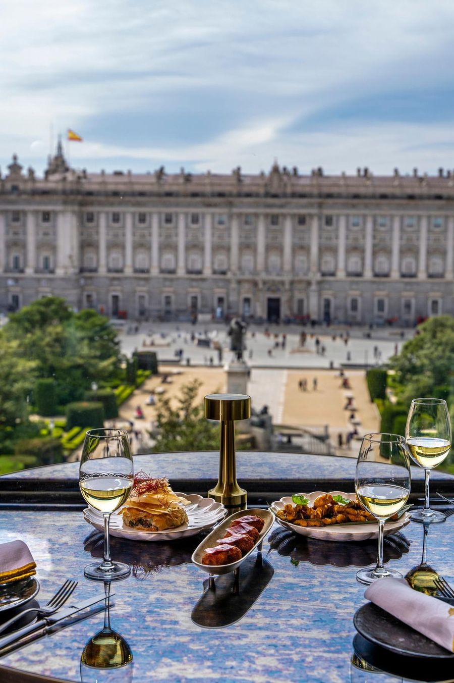 A table for two by the window at Papagena with the Royal Palace and Plaza de Oriente in the background